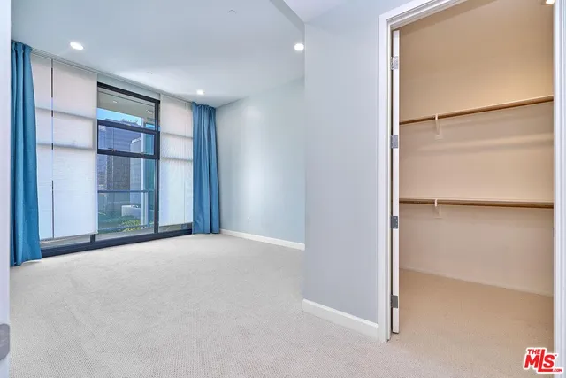 a bathroom with a sink a mirror and a shower