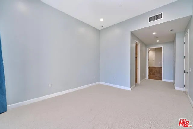 a bathroom with a tub a toilet and a shower