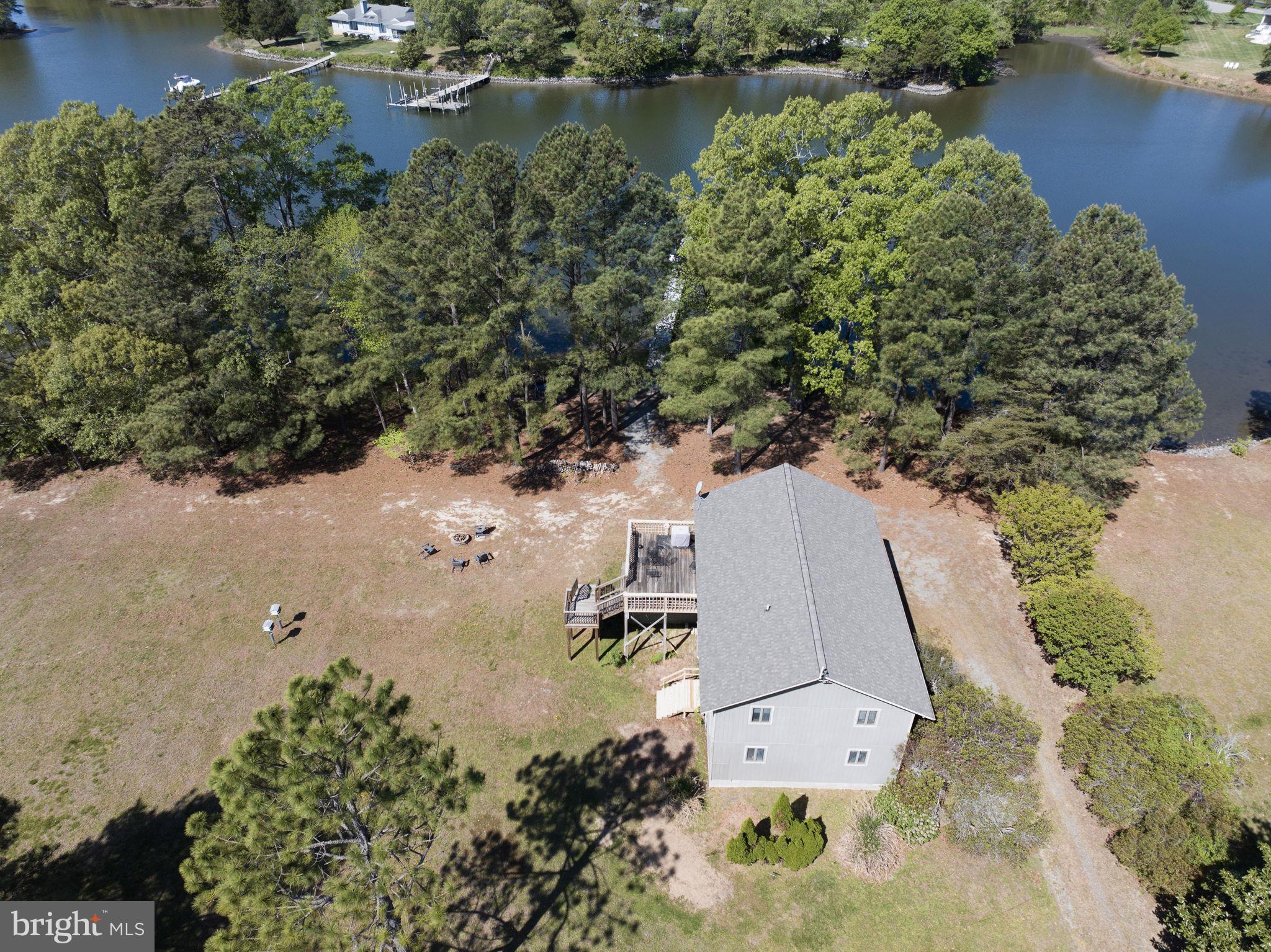 33 Lagrange Avenue Kilmarnock, VA 22482 - Photo 11 of 84 an aerial view of a house with a yard and lake view