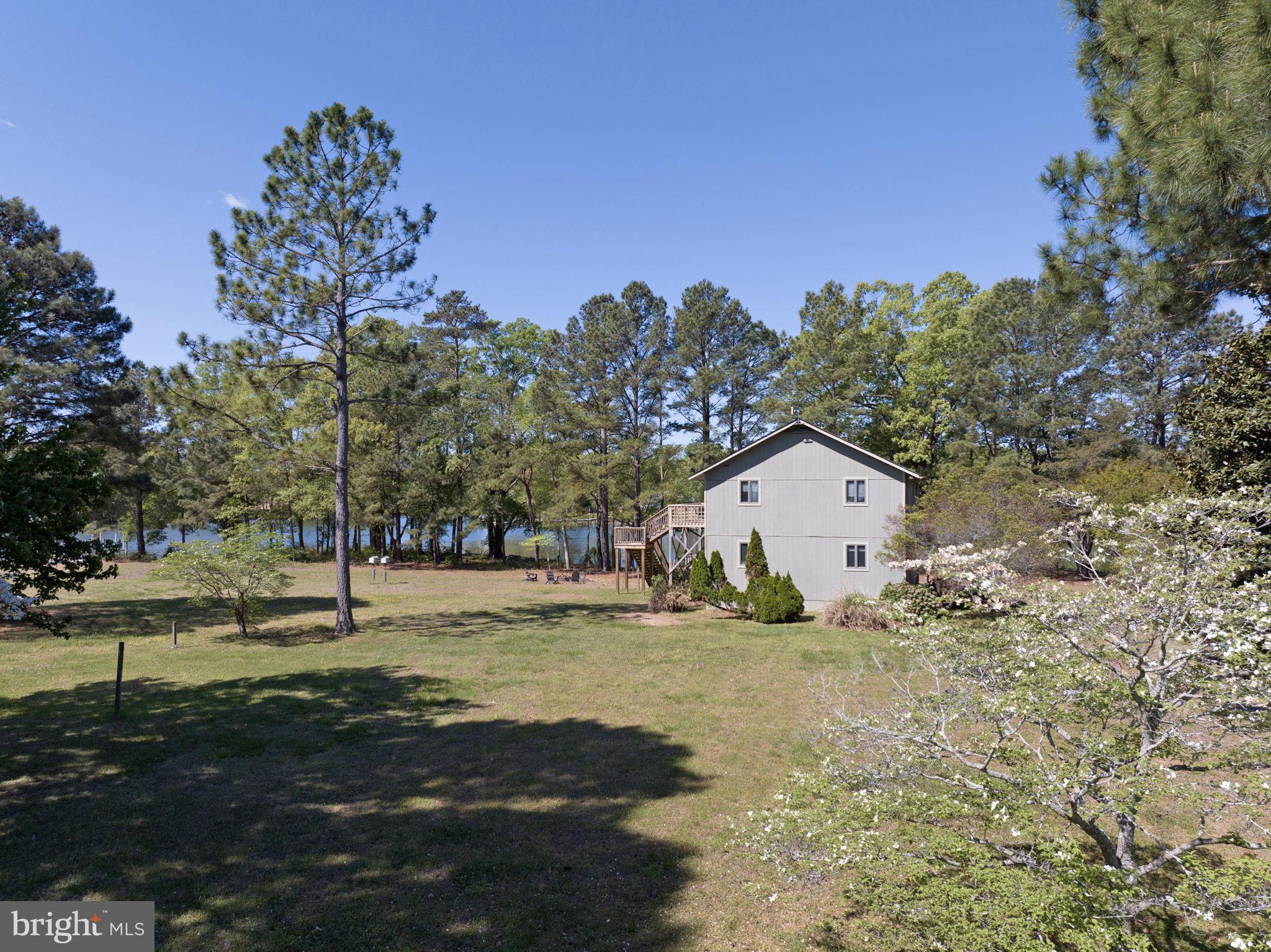 33 Lagrange Avenue Kilmarnock, VA 22482 - Photo 14 of 84 Serene retreat amidst lush greenery.