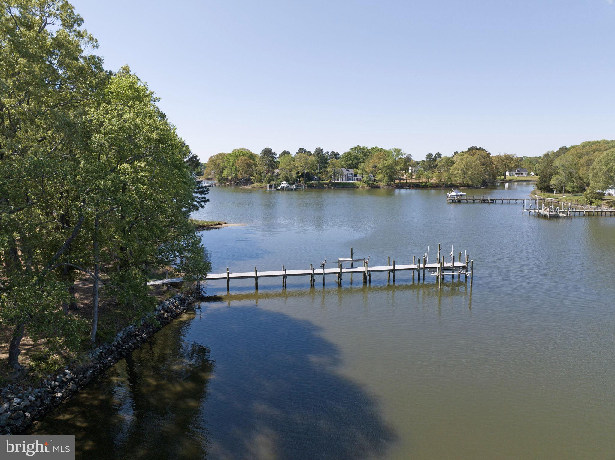 33 Lagrange Avenue Kilmarnock, VA 22482 - Photo 17 of 84 a view of a lake with houses in the back