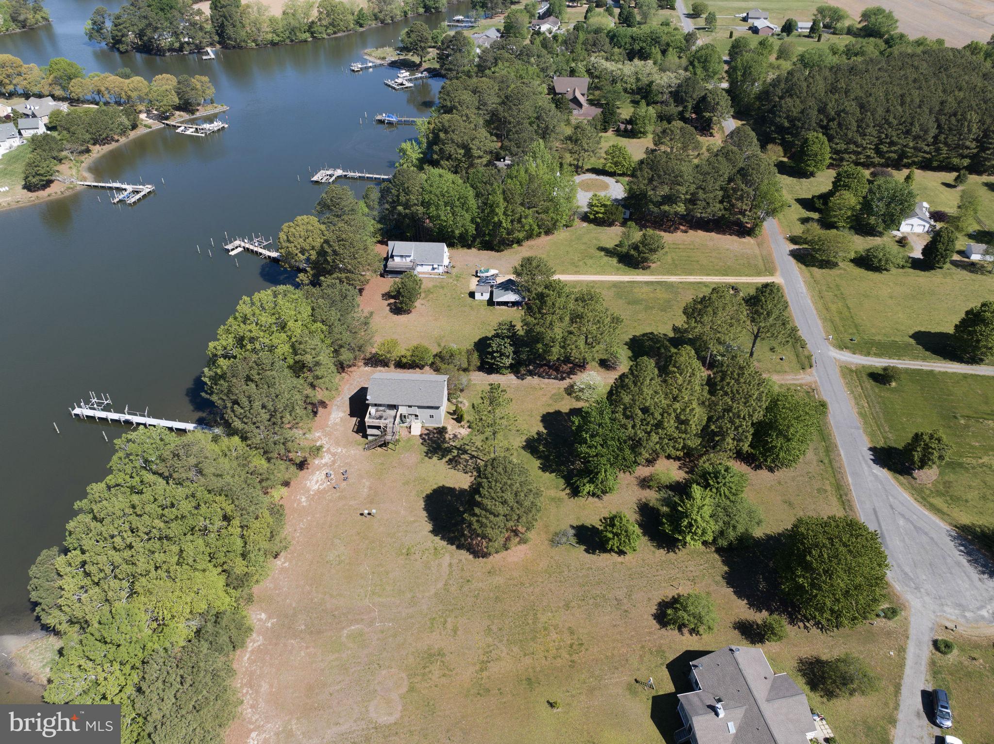 33 Lagrange Avenue Kilmarnock, VA 22482 - Photo 40 of 84 an aerial view of a house with a yard and lake view