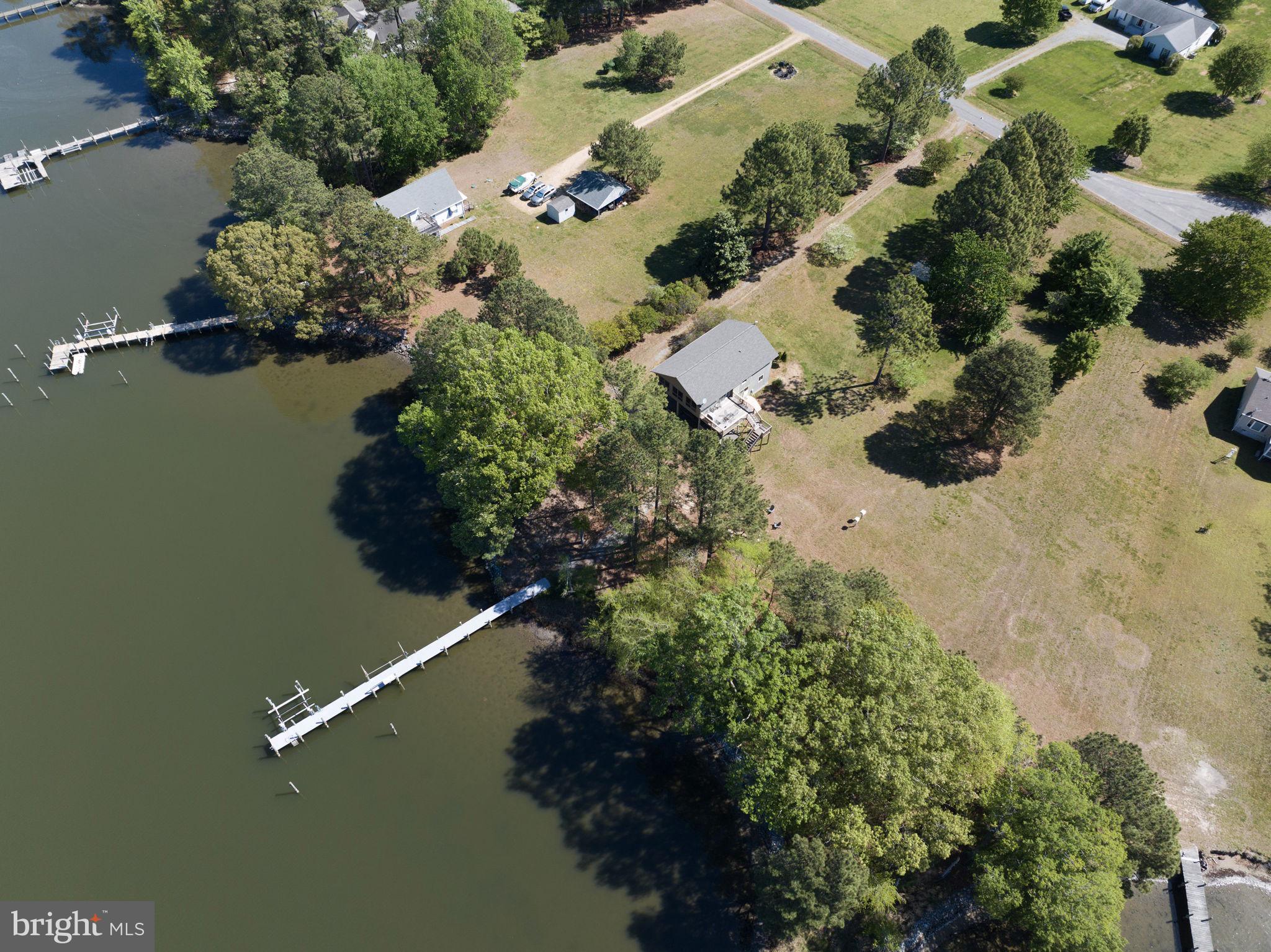 33 Lagrange Avenue Kilmarnock, VA 22482 - Photo 42 of 84 an aerial view of a house with a yard and lake view