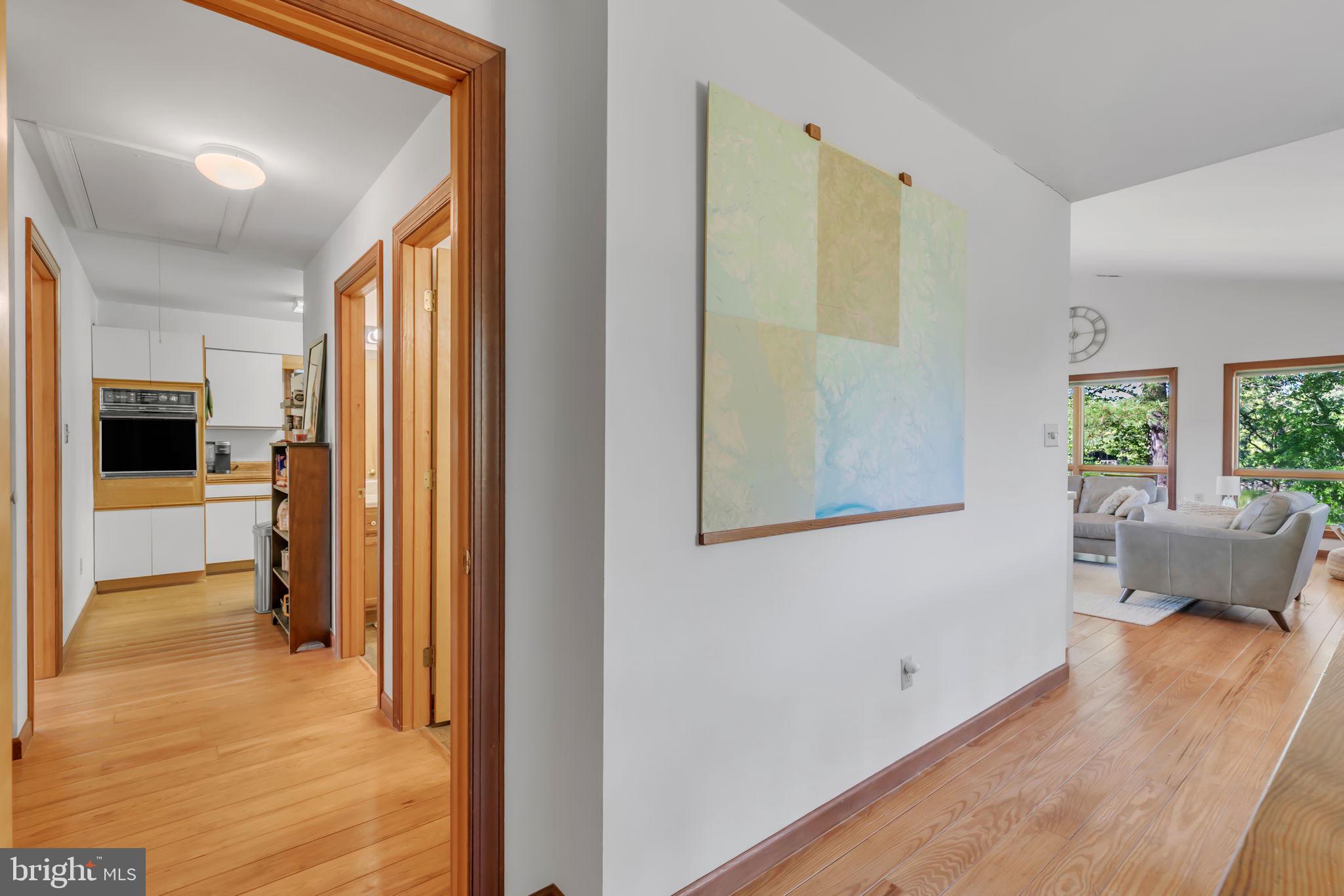 33 Lagrange Avenue Kilmarnock, VA 22482 - Photo 60 of 84 a view of a hallway with wooden floor and a living room