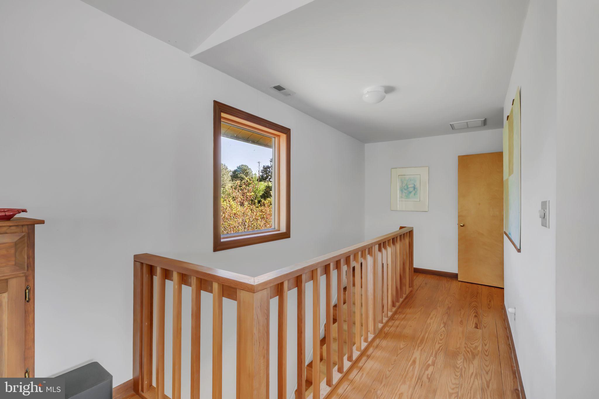 33 Lagrange Avenue Kilmarnock, VA 22482 - Photo 75 of 84 Bright and airy hallway with views.