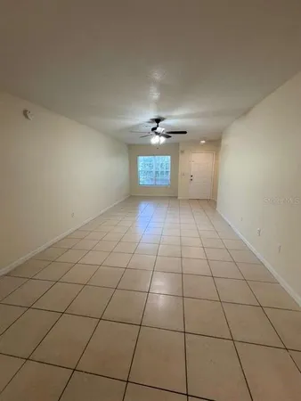 a view of an empty room and a window