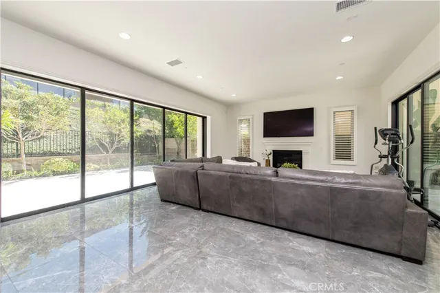 a kitchen with stainless steel appliances kitchen island granite countertop a table and chairs in it