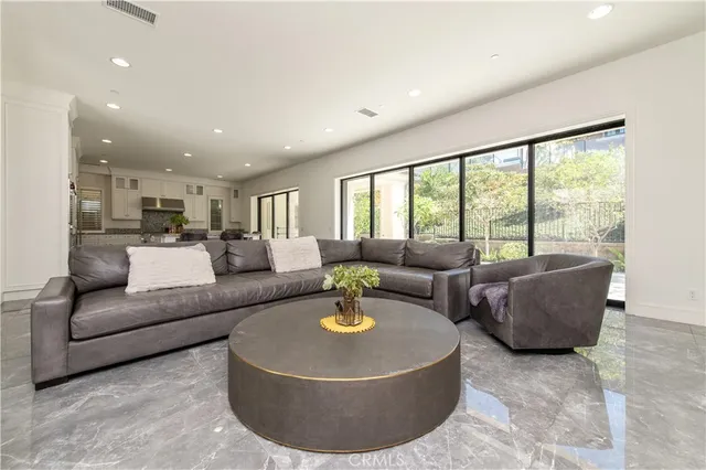 a living room with a fireplace and a flat screen tv