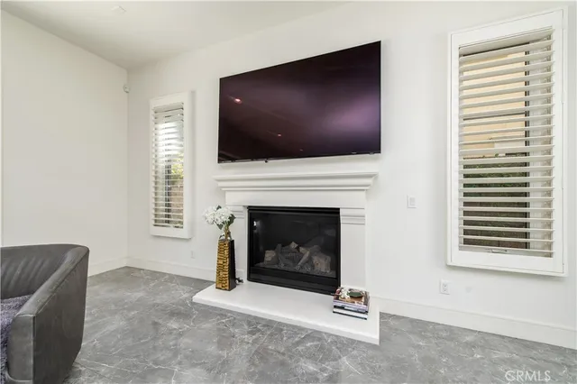 a kitchen with a table chairs refrigerator and cabinets