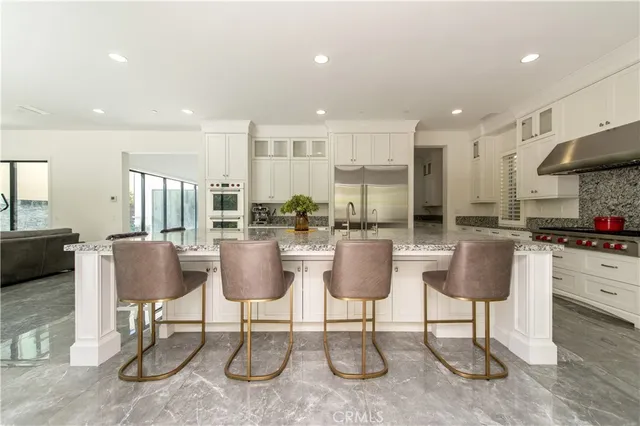 a view of hall with wooden floor and windows