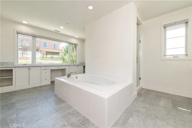 a bathroom with a bathtub and a sink