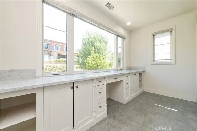 a utility room with sink dryer and washer