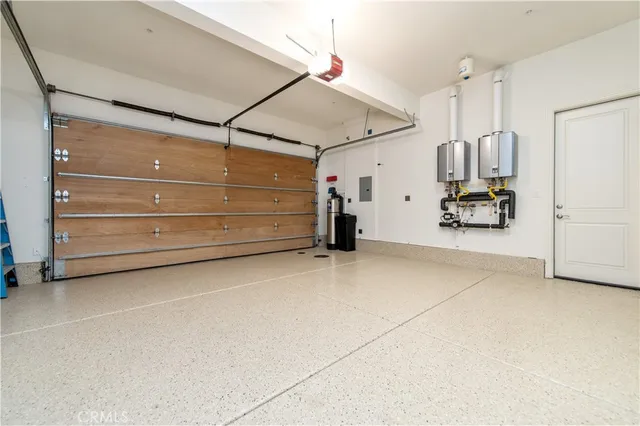 a view of an outdoor dining space with a table and chairs