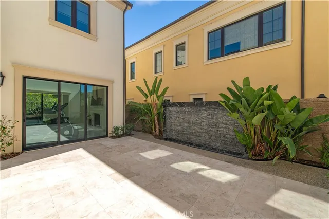 a view of a patio with a backyard