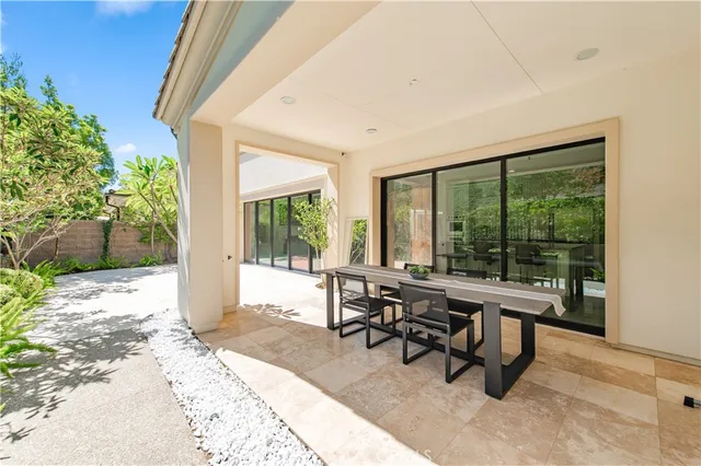 a view of a garden with a building in the background