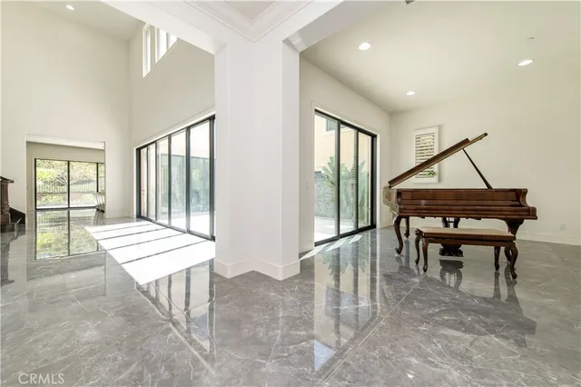 a reading room with furniture and a potted plant