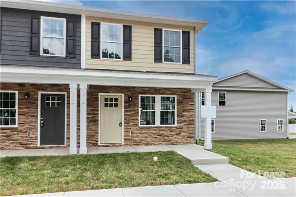 front view of a house with a yard