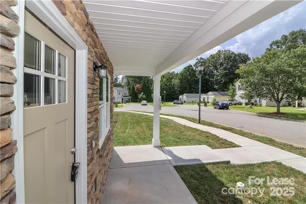 a view of a porch with a backyard