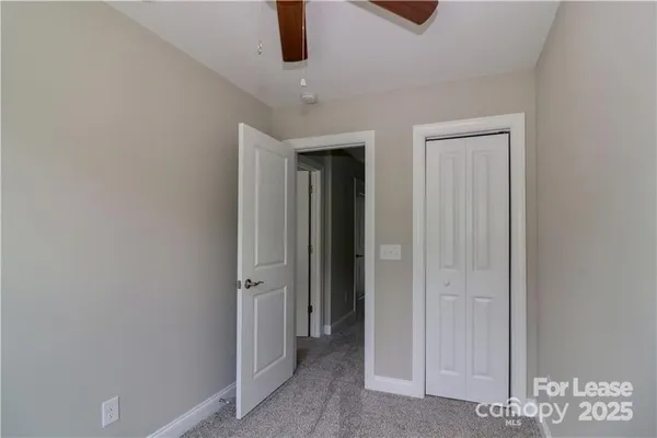 an entryway with a ceiling fan