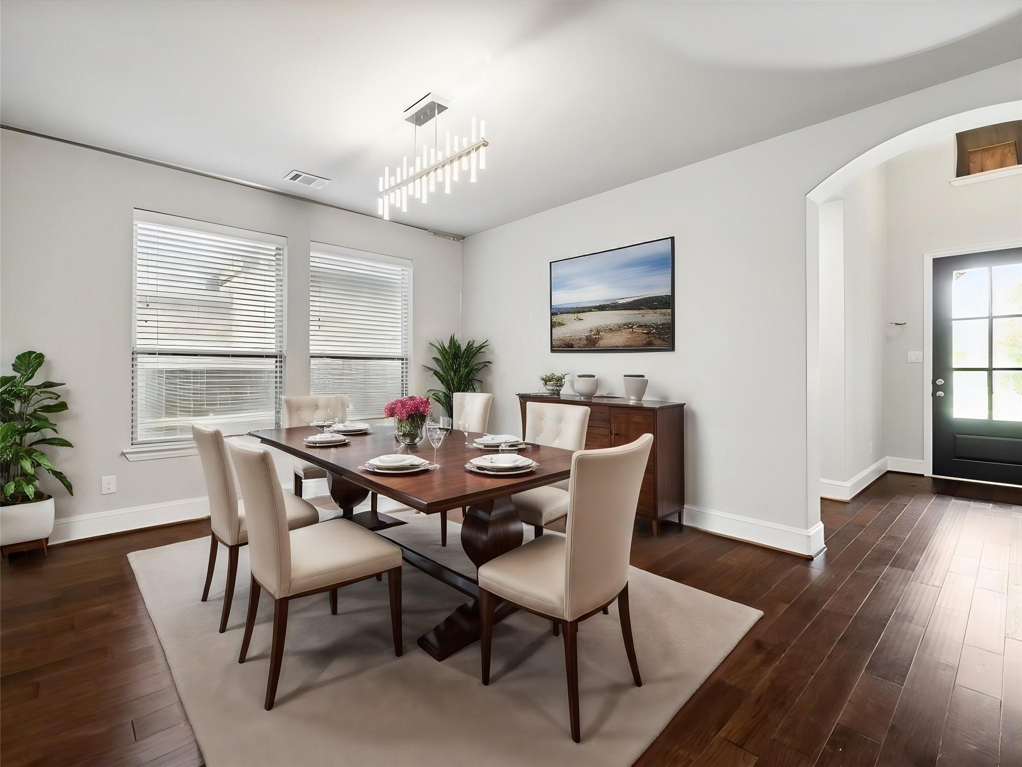 1010 Bat Hawk Court Conroe, TX 77385 - Photo 6 of 50 a view of a dining room with furniture window and wooden floor
