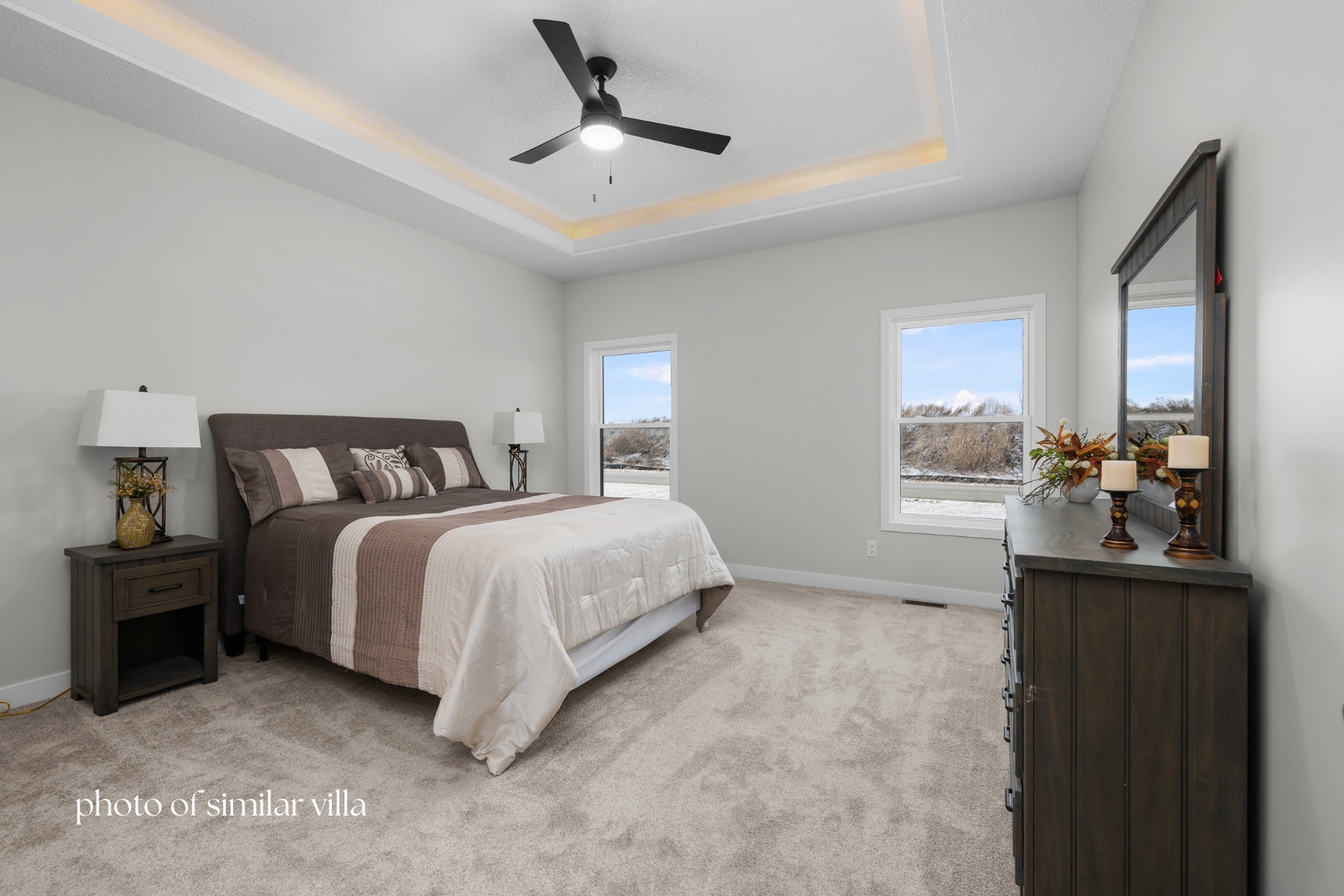 1875 Redbud Circle, Unit 103 Eldridge, IA 52748 - Photo 17 of 32 a bedroom with a bed and a window