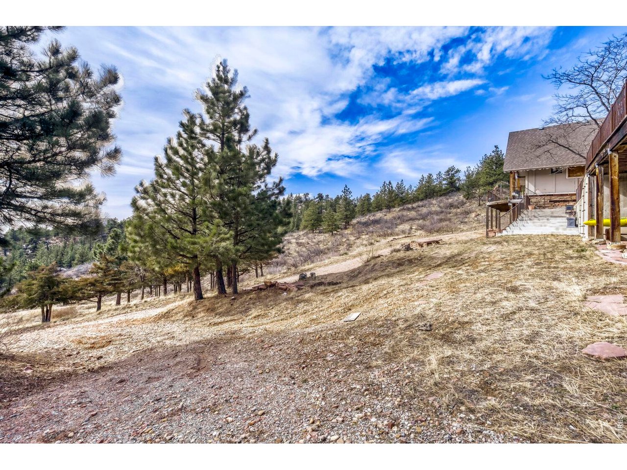 1042 Steamboat Valley Road Lyons, CO 80540 - Photo 40 of 46 Plenty of flat space on the exterior of this mountain home... Create a pond, pool, hot tub area, more parking