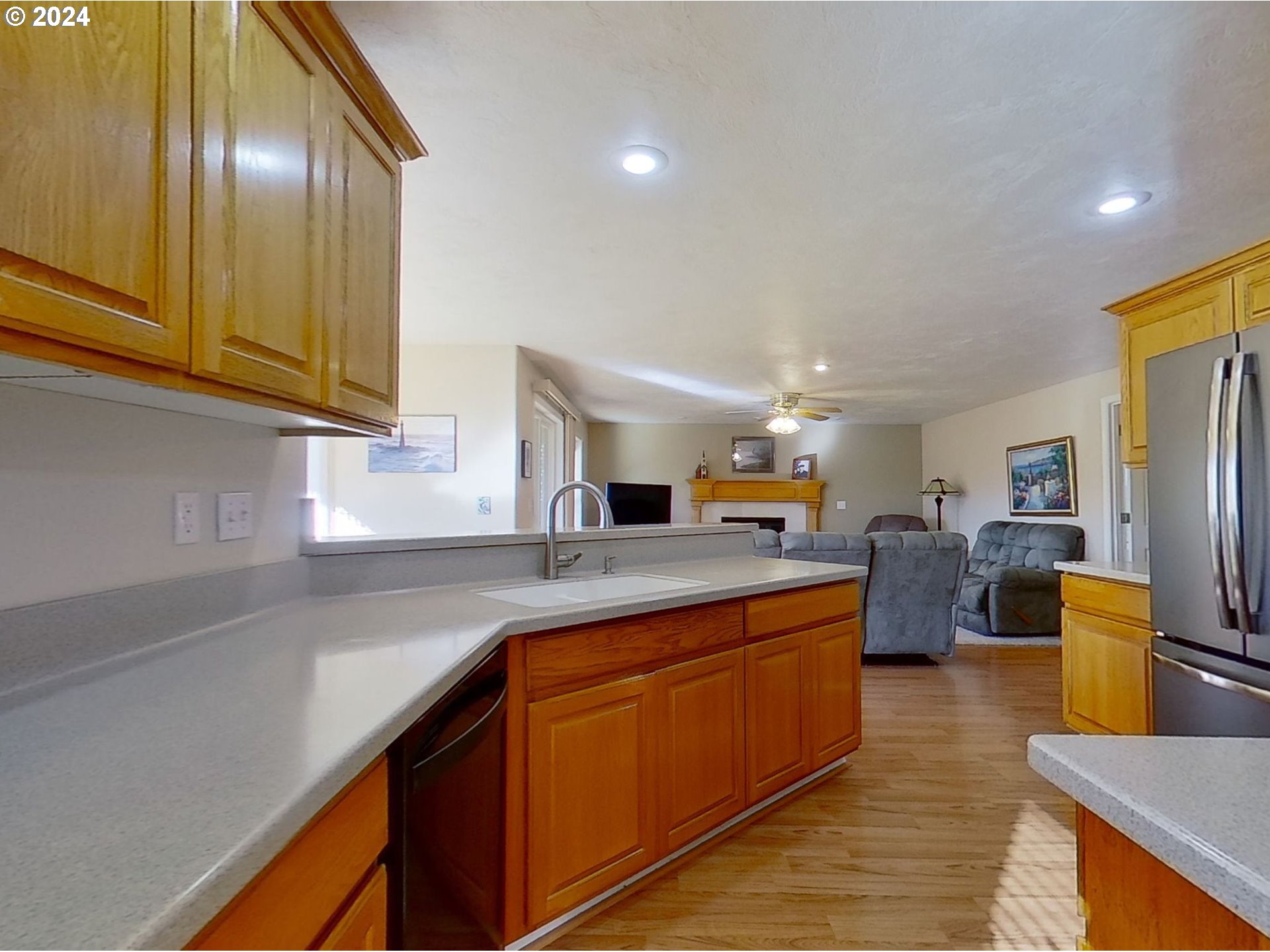2278 33rd Street Springfield, OR 97477 - Photo 14 of 41 a kitchen with wooden cabinets and stainless steel appliances