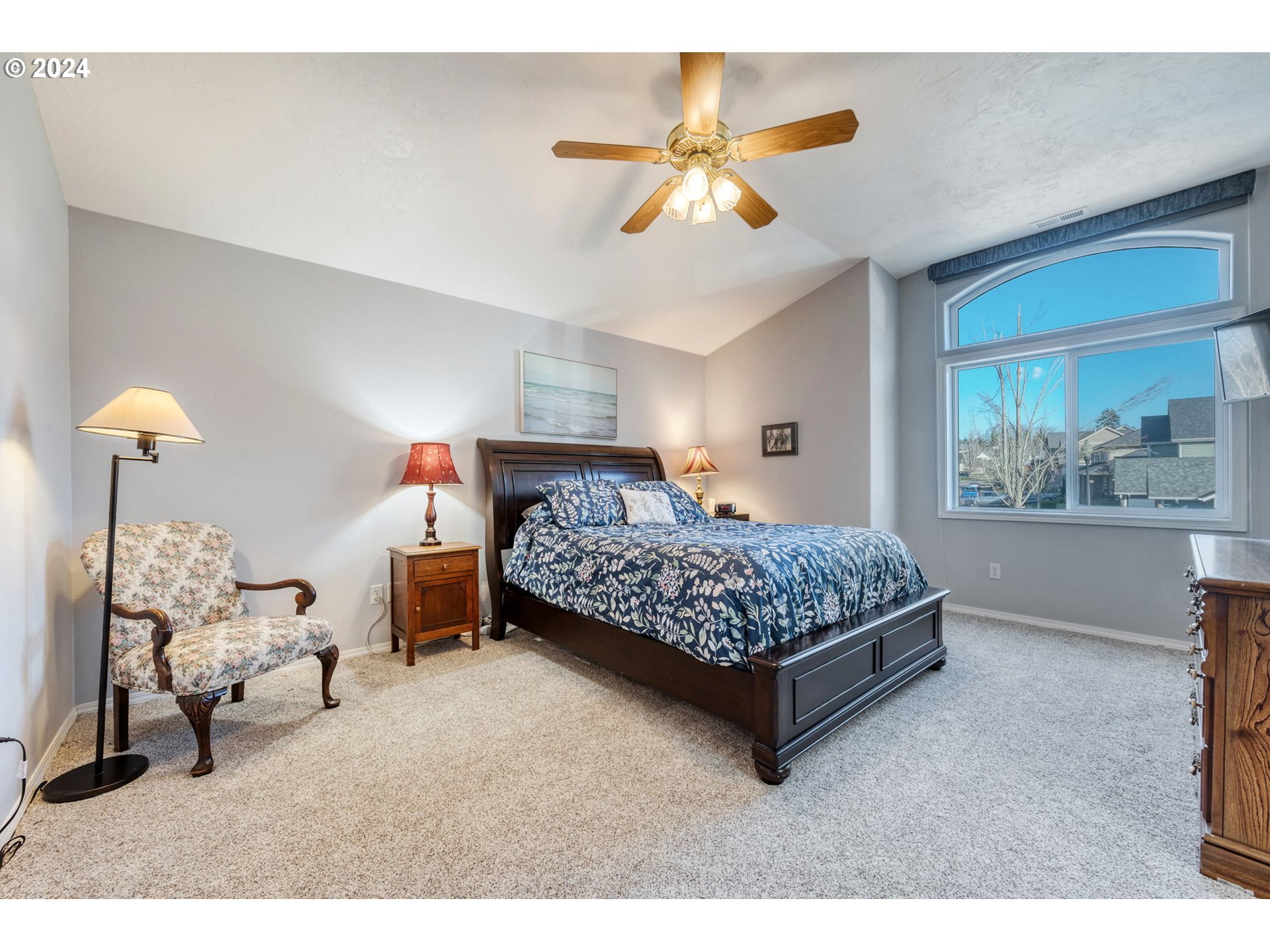 2278 33rd Street Springfield, OR 97477 - Photo 20 of 41 a bedroom with a bed and a chandelier