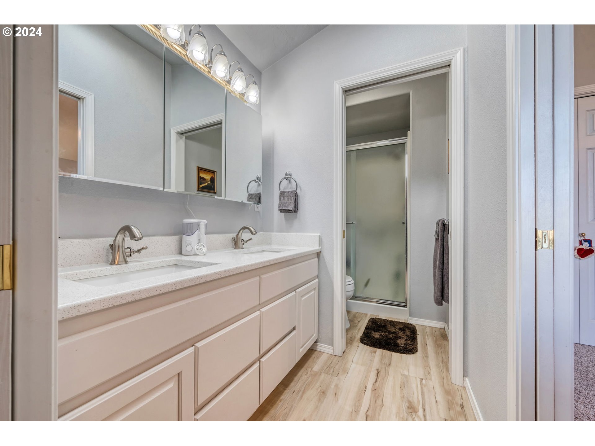 2278 33rd Street Springfield, OR 97477 - Photo 24 of 41 a bathroom with a sink a toilet and a mirror