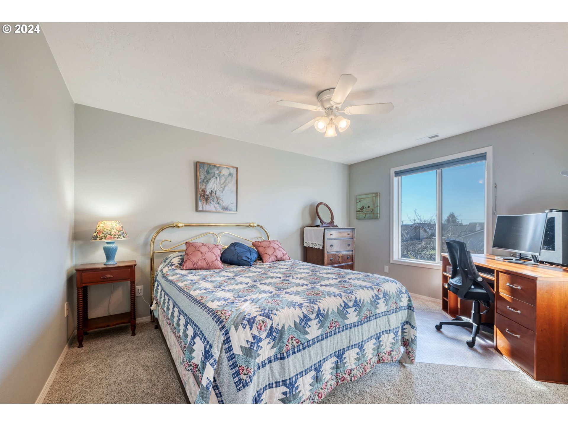 2278 33rd Street Springfield, OR 97477 - Photo 28 of 41 a bedroom with a bed a desk and chair