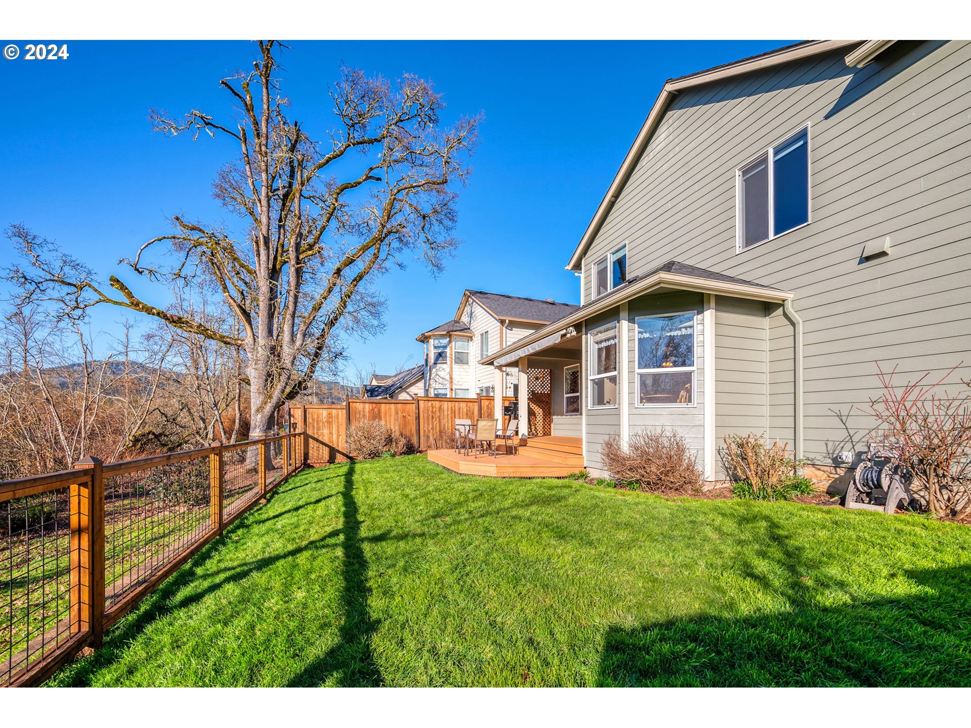 2278 33rd Street Springfield, OR 97477 - Photo 39 of 41 a view of a yard in front of a house with a large tree