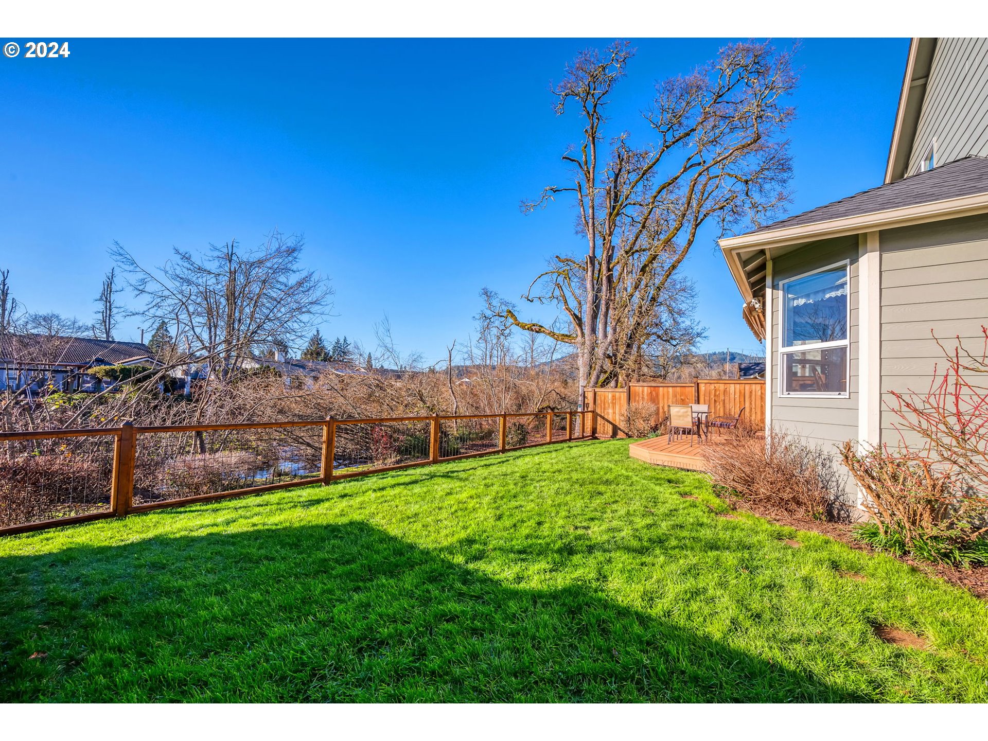2278 33rd Street Springfield, OR 97477 - Photo 5 of 41 a view of a backyard with wooden fence