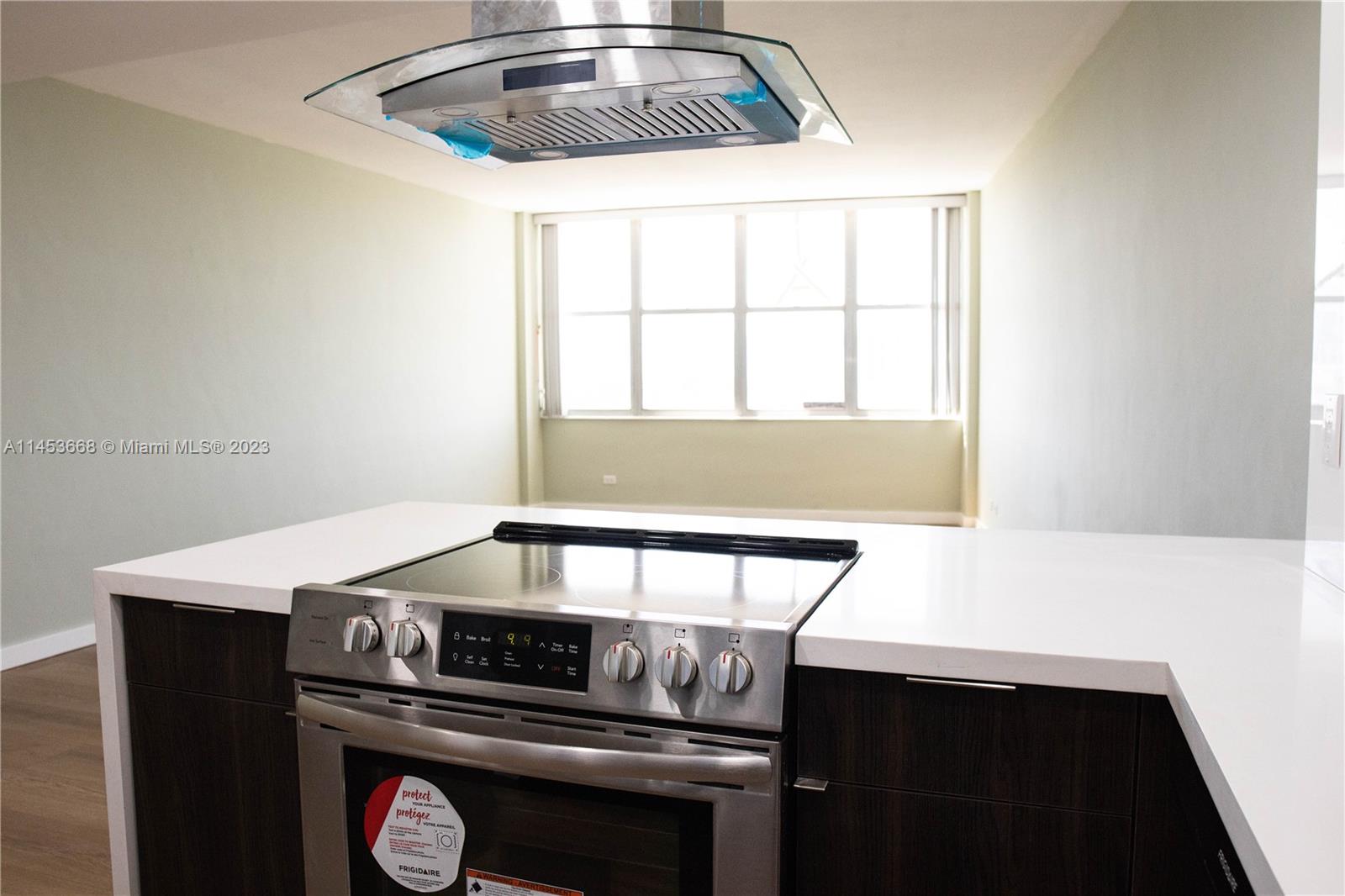 a kitchen with a stove and a microwave