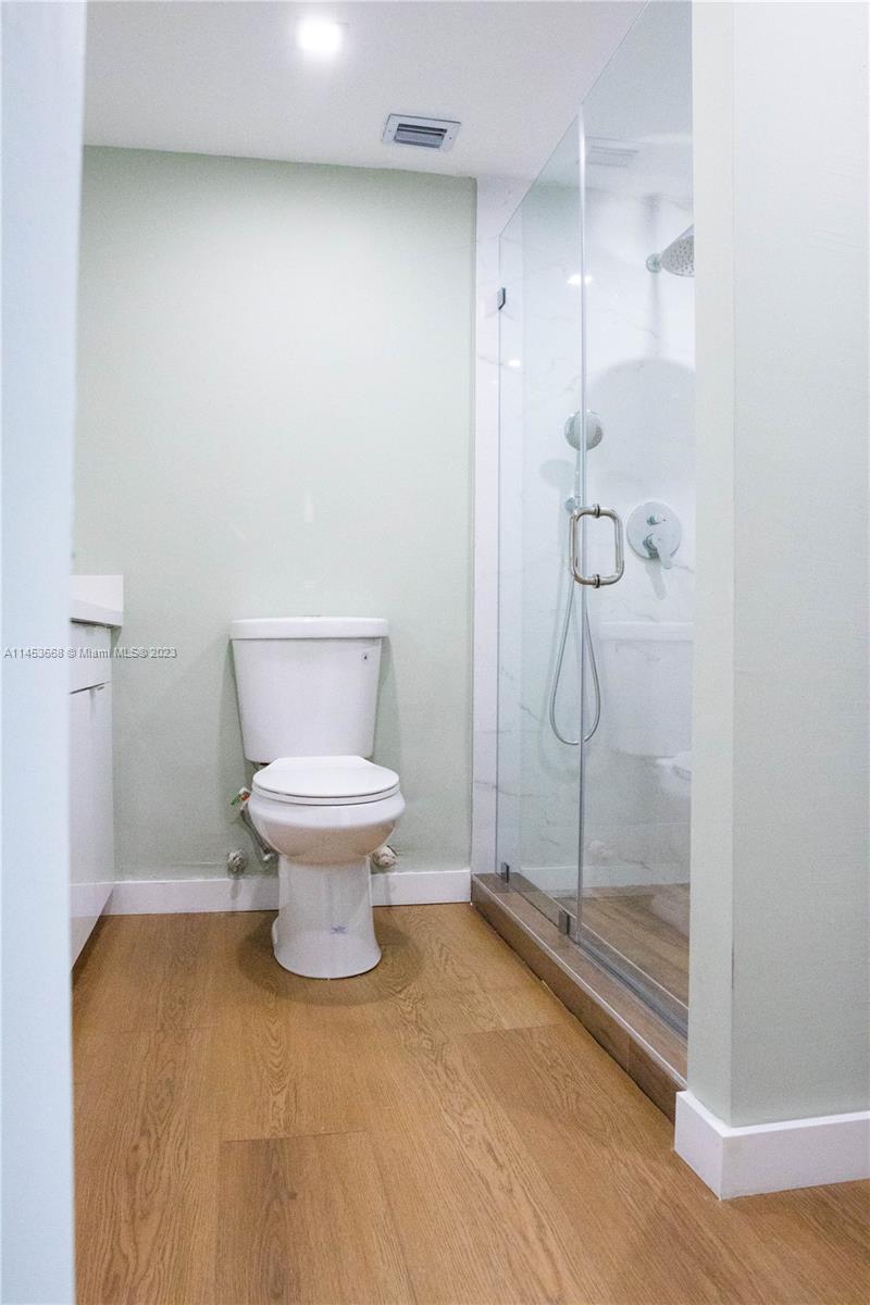 North Beach Miami Beach, FL 33141 - Photo 15 of 30 a bathroom with a toilet and a shower