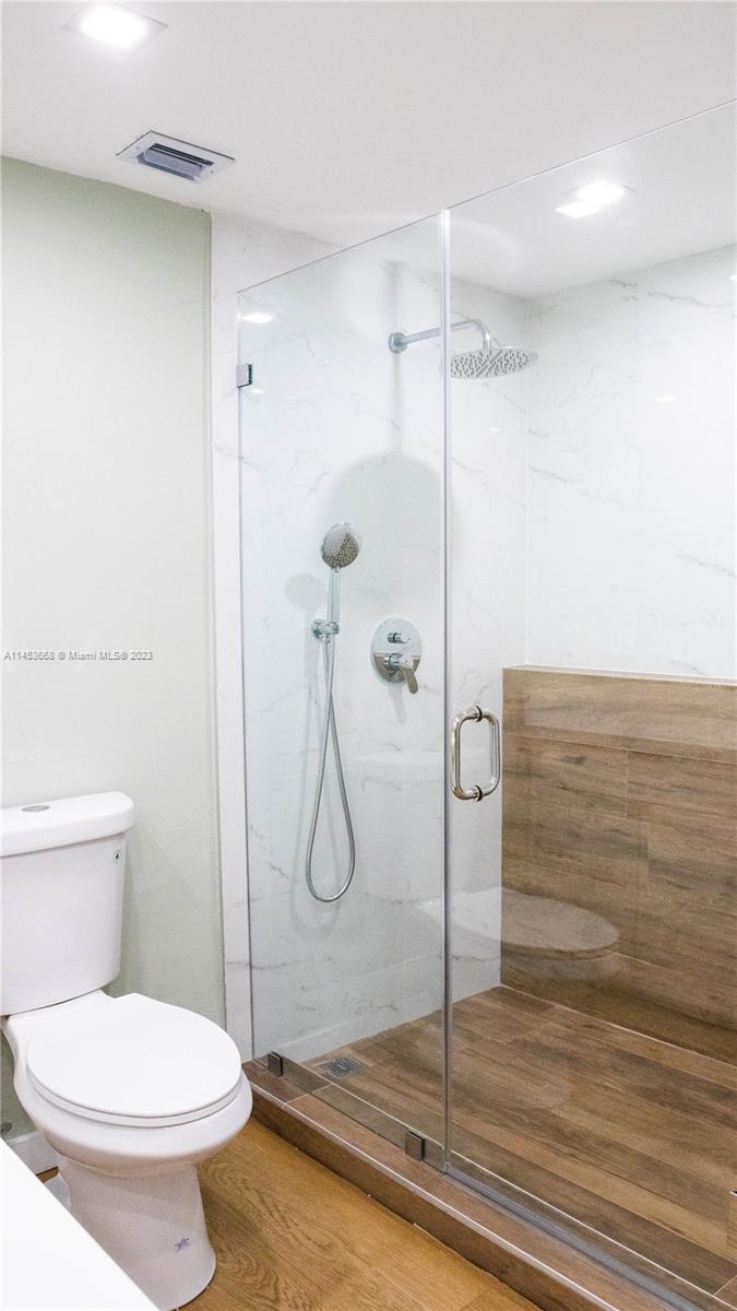 North Beach Miami Beach, FL 33141 - Photo 17 of 30 a bathroom with a toilet and a shower