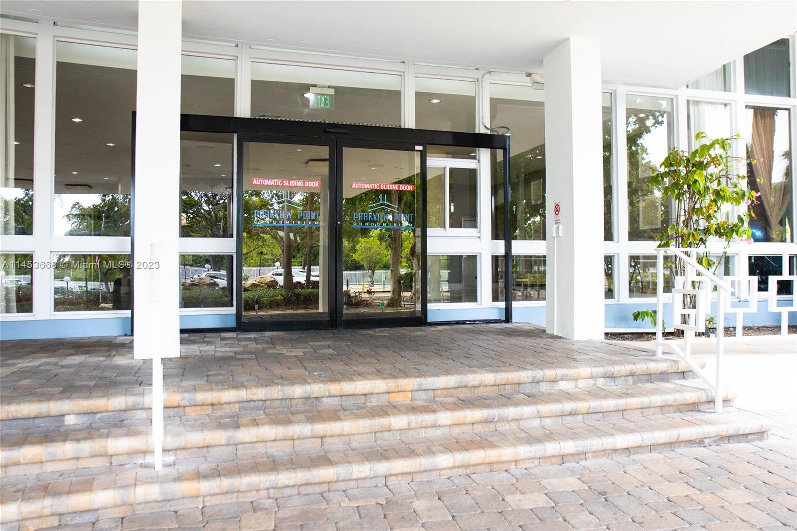North Beach Miami Beach, FL 33141 - Photo 21 of 30 a view of a building with a floor to ceiling windows and a porch