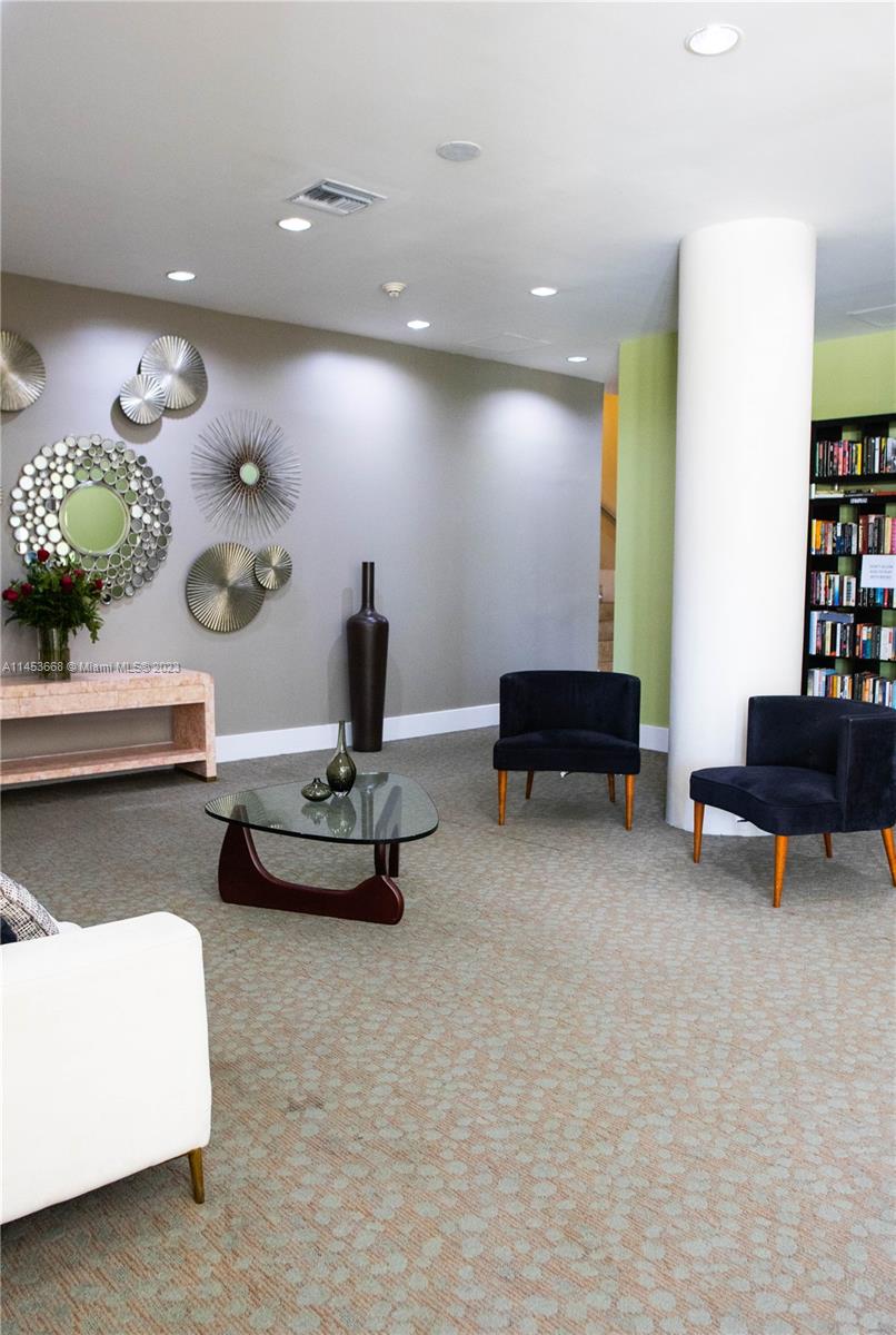 North Beach Miami Beach, FL 33141 - Photo 24 of 30 a living room with furniture and flowers