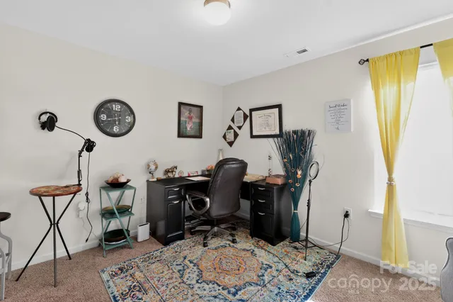 a view of workspace with wooden floor windows