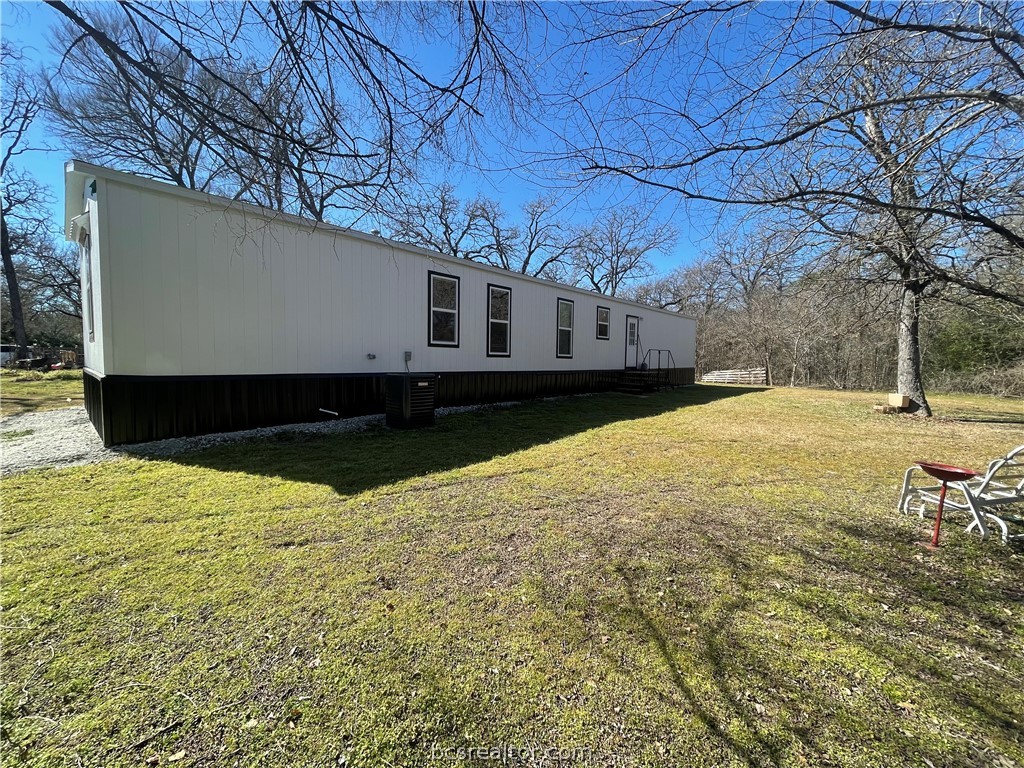 11320 Old Hearne Road Bryan, TX 77807 - Photo 22 of 26 a view of a yard with wooden fence