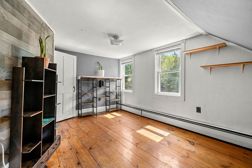 600 Main Street Ashby, MA 01431 - Photo 31 of 40 a view of empty room with wooden floor and window