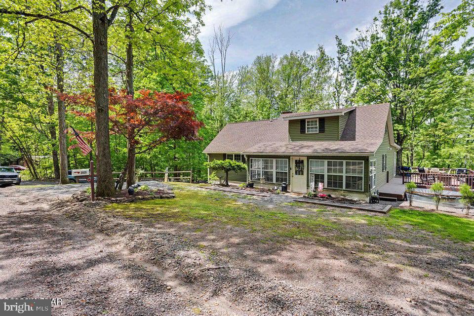 2025 Whiskey Run Road Muncy Valley, PA 17758 - Photo 3 of 54 Charming home nestled in lush greenery.