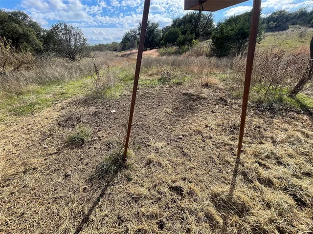 a view of a lake in between the bunch of trees