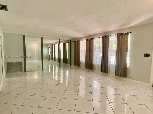 a view of an empty room and window