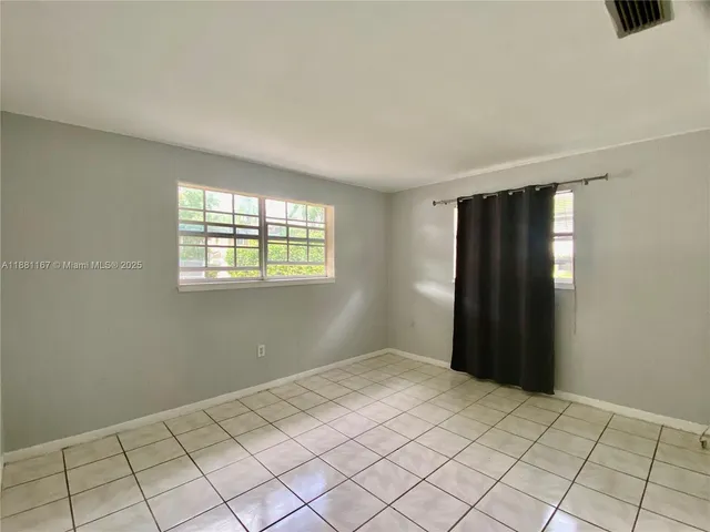 a view of an empty room and window