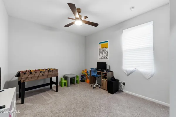 a living room with furniture a air conditioner and a window