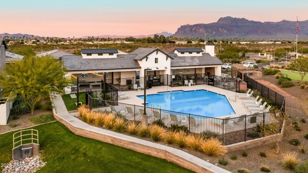 a view of a swimming pool with a lake view