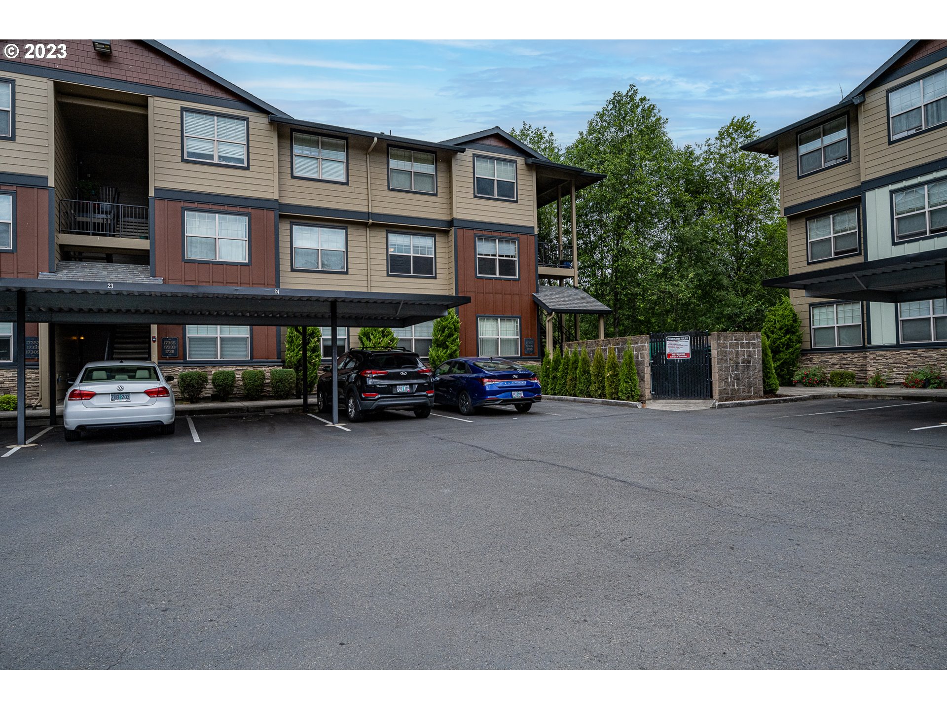 a couple of cars parked in front of a building