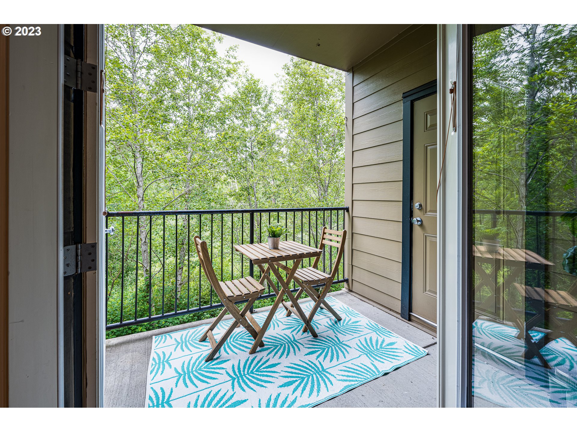 17335 Ruben Lane, Unit 19 Sandy, OR 97055 - Photo 20 of 27 a view of a chair and table in the balcony