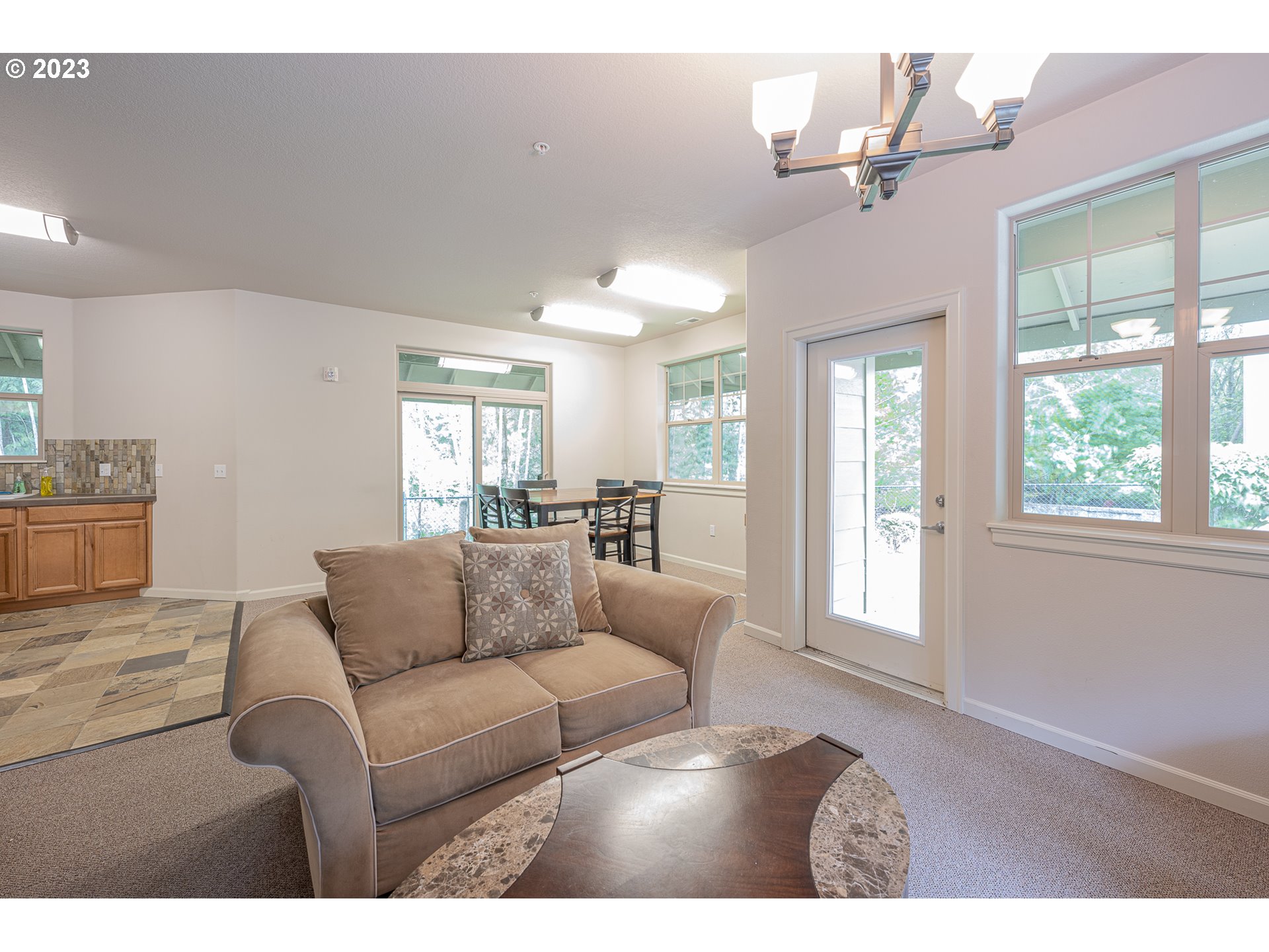 17335 Ruben Lane, Unit 19 Sandy, OR 97055 - Photo 26 of 27 a living room with furniture and a large window