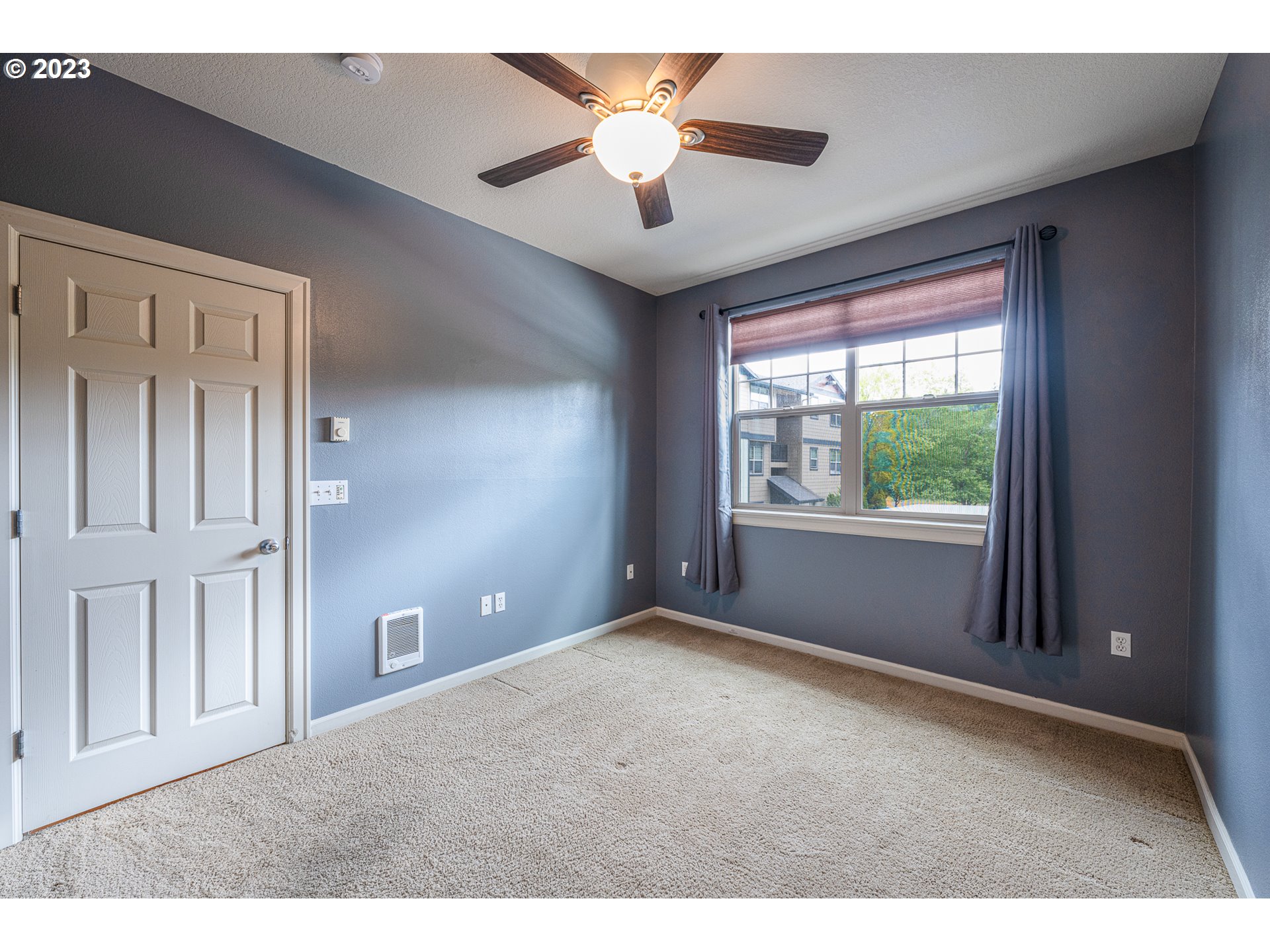 17335 Ruben Lane, Unit 19 Sandy, OR 97055 - Photo 9 of 27 a view of an empty room with a window